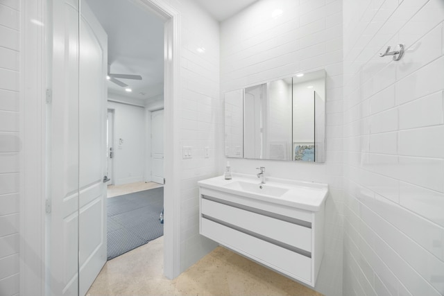 bathroom featuring ceiling fan and vanity