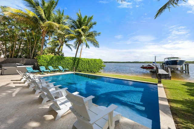 view of swimming pool featuring a dock and a water view