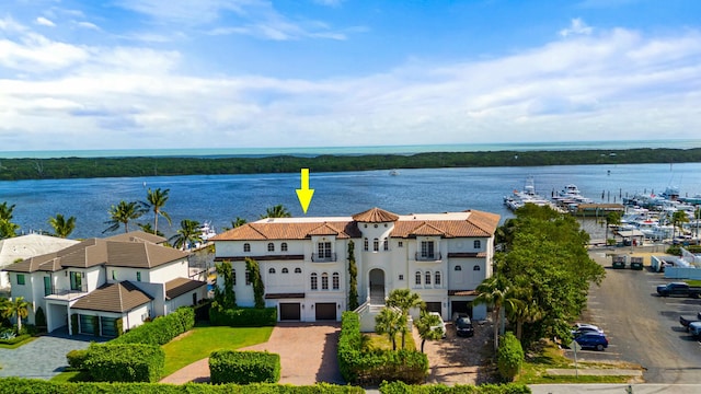 birds eye view of property featuring a water view