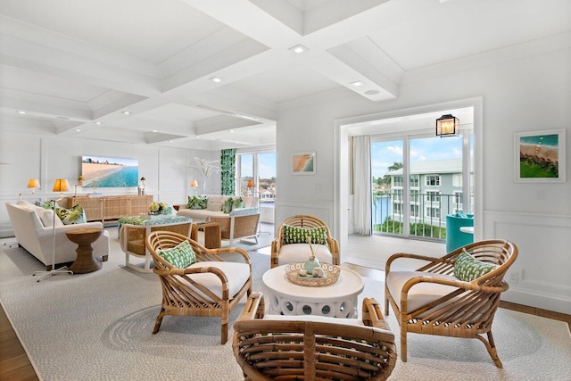 living area with beam ceiling, crown molding, hardwood / wood-style floors, and coffered ceiling