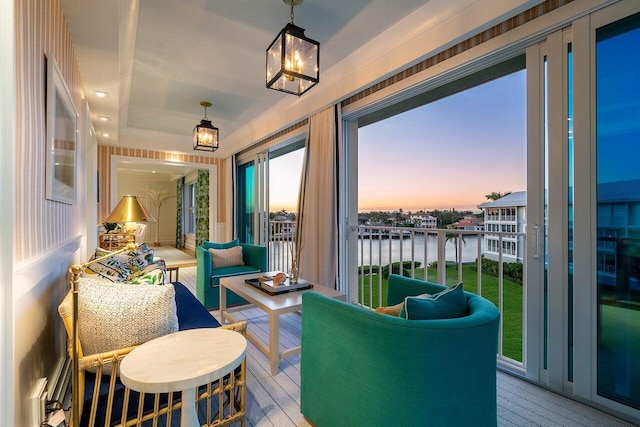 sunroom / solarium with a water view