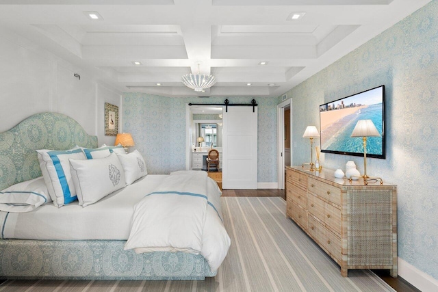 bedroom featuring a barn door, beamed ceiling, wood-type flooring, and coffered ceiling