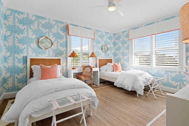 bedroom featuring multiple windows and ceiling fan