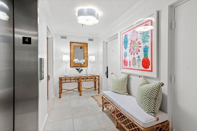 corridor featuring light tile patterned floors, ornamental molding, and elevator