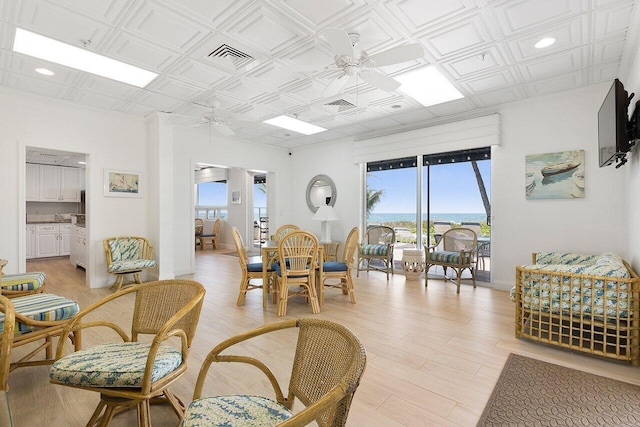 interior space with light hardwood / wood-style flooring and ceiling fan