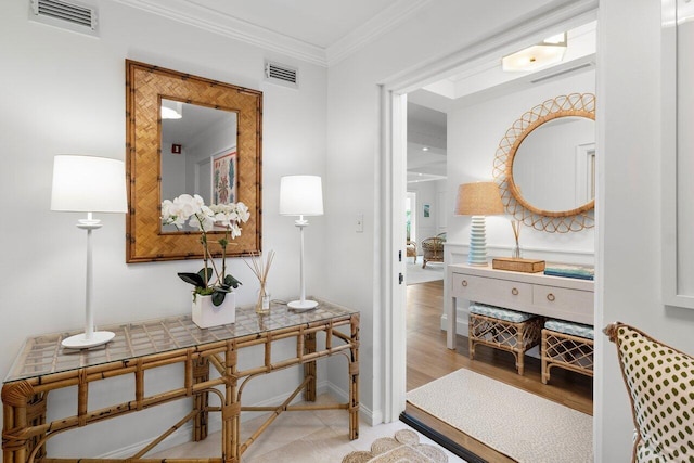 corridor featuring light hardwood / wood-style floors and ornamental molding