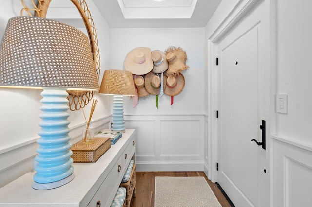 mudroom with dark hardwood / wood-style flooring and a skylight