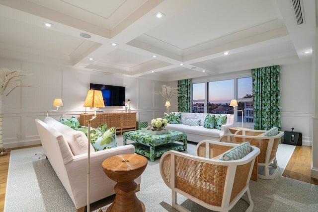 living room with beam ceiling, light hardwood / wood-style floors, and coffered ceiling