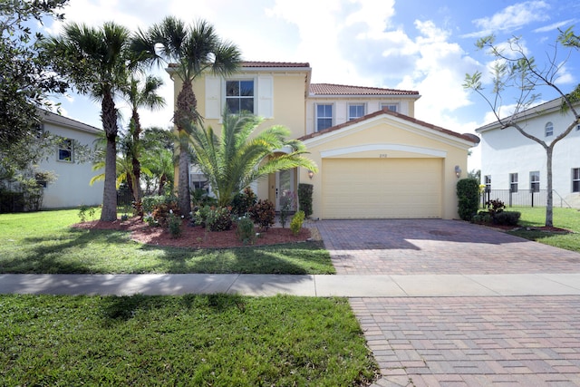 mediterranean / spanish-style home featuring a front lawn