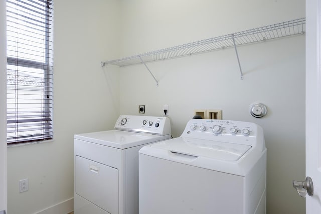 clothes washing area featuring washing machine and dryer