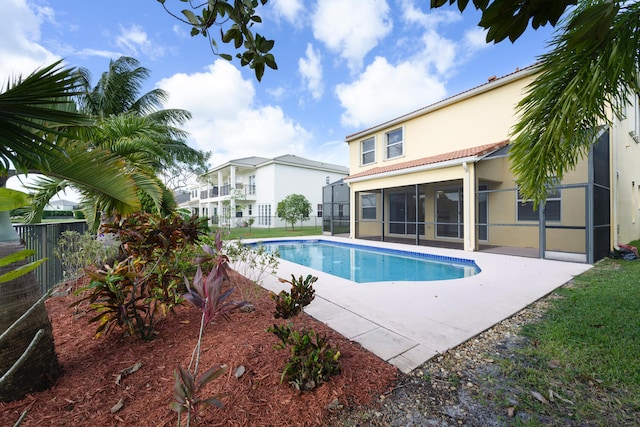 view of pool featuring a patio and a sunroom