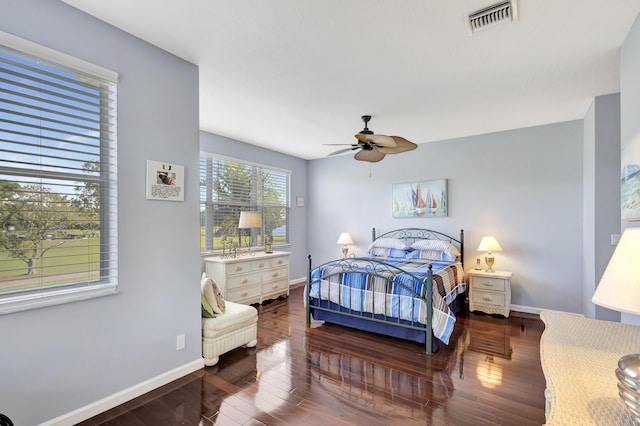 bedroom featuring ceiling fan and dark wood-type flooring