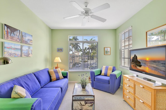 living room featuring ceiling fan and light carpet