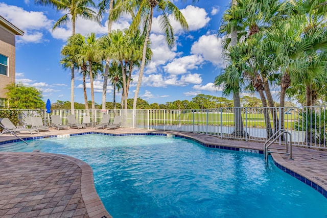 view of swimming pool with a patio area