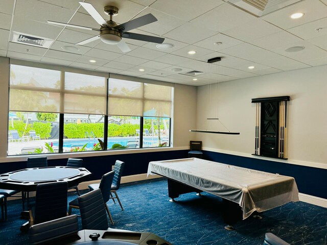 game room with a drop ceiling, carpet floors, ceiling fan, and pool table