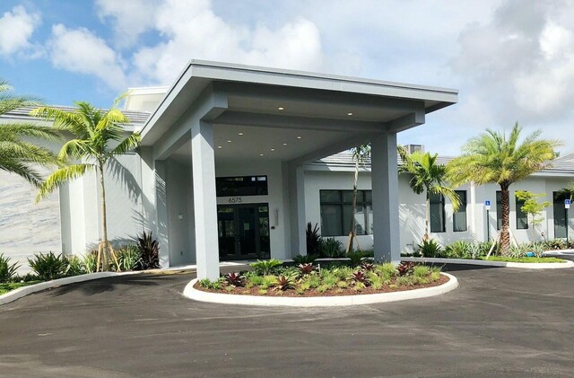 6675 S Oriole Blvd Unit 2050, Delray Beach, FL 33446 - sunroom / solarium featuring a water view and a ceiling fan