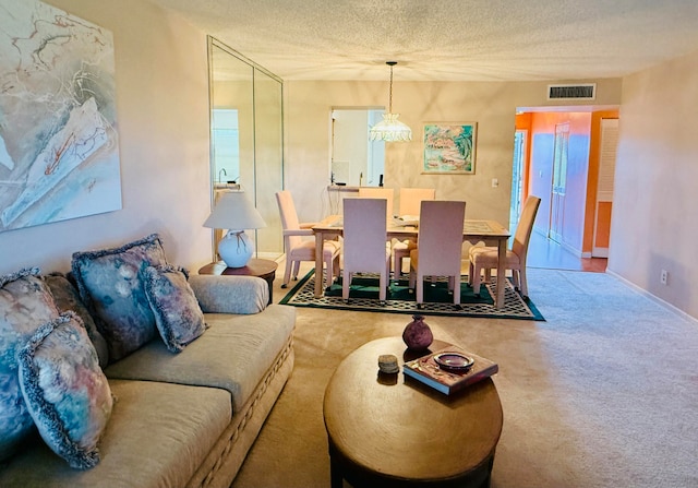 carpeted living room with a textured ceiling