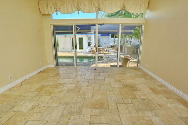 unfurnished room featuring a wealth of natural light