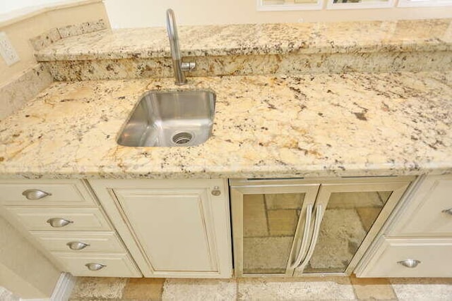 interior details with sink and cream cabinets