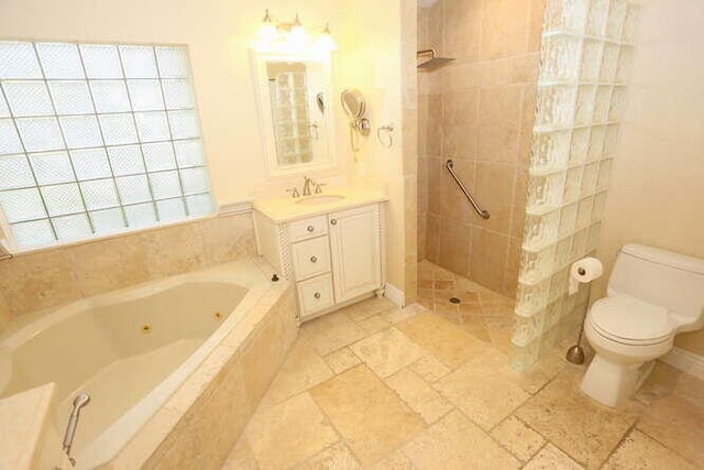 full bathroom with vanity, toilet, and plus walk in shower