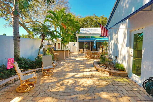 view of patio featuring exterior bar