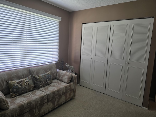 112 Lake Dora Dr, West Palm Beach, FL 33411 - carpeted living room with a textured ceiling