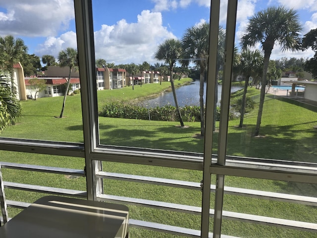 112 Lake Dora Dr, West Palm Beach, FL 33411 - doorway to outside with a water view