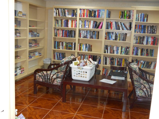 112 Lake Dora Dr, West Palm Beach, FL 33411 - living area with wall of books and tile patterned floors