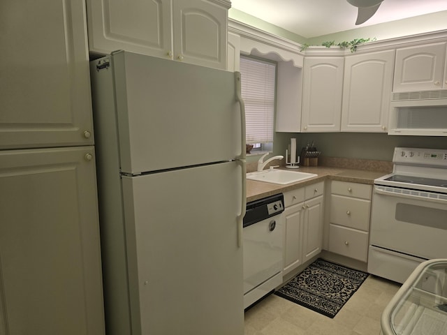 112 Lake Dora Dr, West Palm Beach, FL 33411 - kitchen featuring white appliances, a sink, white cabinets, and light countertops
