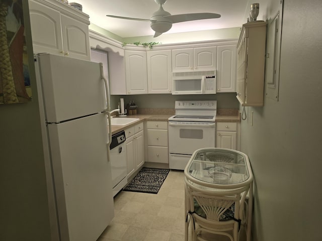 112 Lake Dora Dr, West Palm Beach, FL 33411 - kitchen with white appliances, a sink, white cabinetry, a ceiling fan, and light flooring