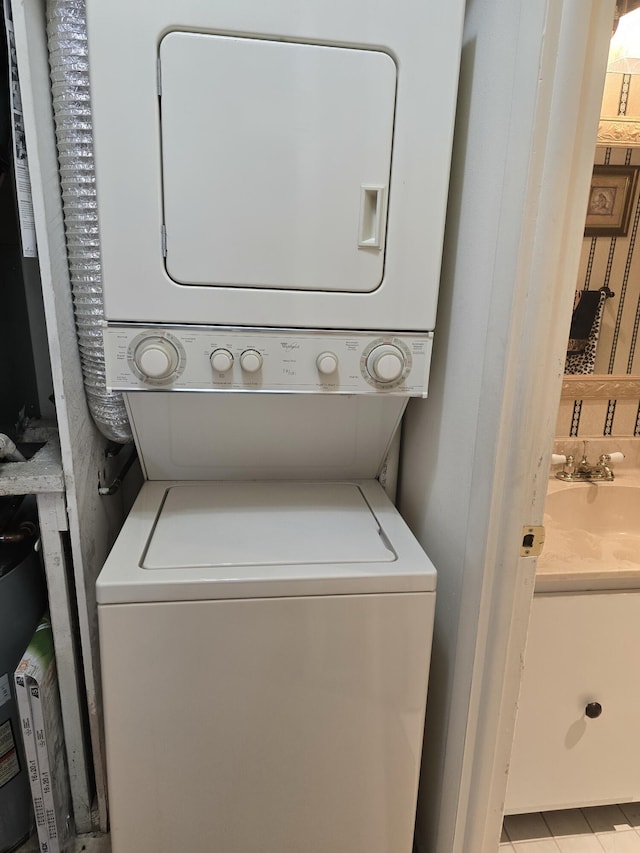 washroom featuring stacked washer and dryer