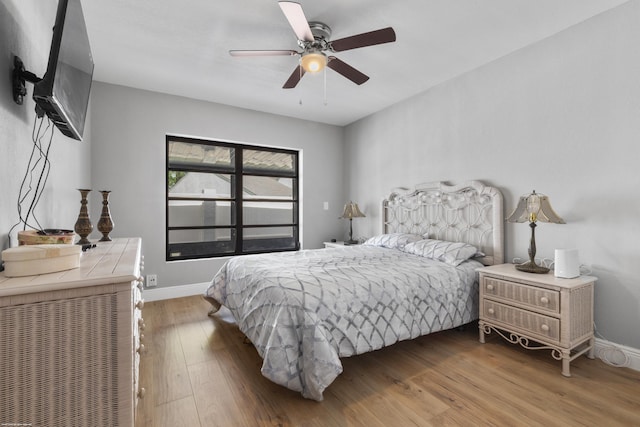 bedroom featuring hardwood / wood-style floors and ceiling fan