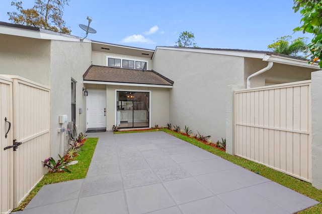 back of property featuring a patio