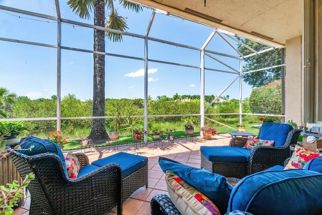 view of patio with glass enclosure and an outdoor living space