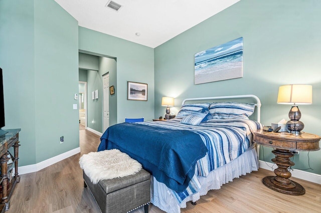 bedroom featuring hardwood / wood-style floors