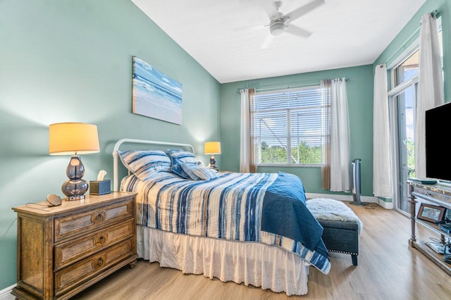 bedroom with ceiling fan and light hardwood / wood-style floors