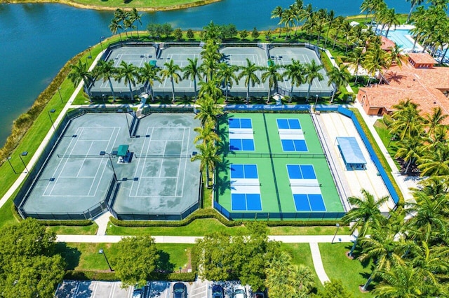 birds eye view of property with a water view