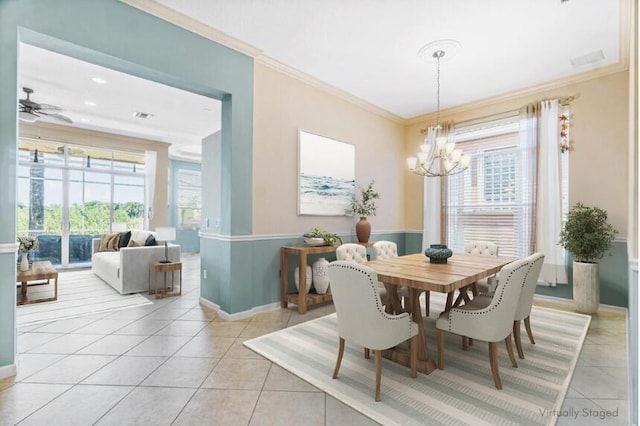 dining room featuring light tile patterned floors, ceiling fan with notable chandelier, and ornamental molding