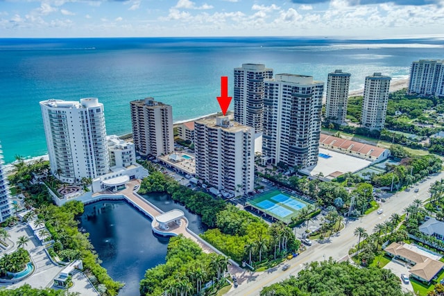 birds eye view of property with a water view