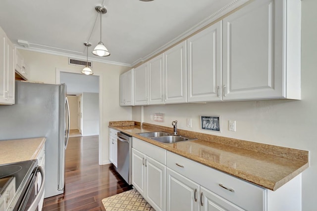 kitchen with white cabinets, pendant lighting, dark hardwood / wood-style floors, and appliances with stainless steel finishes