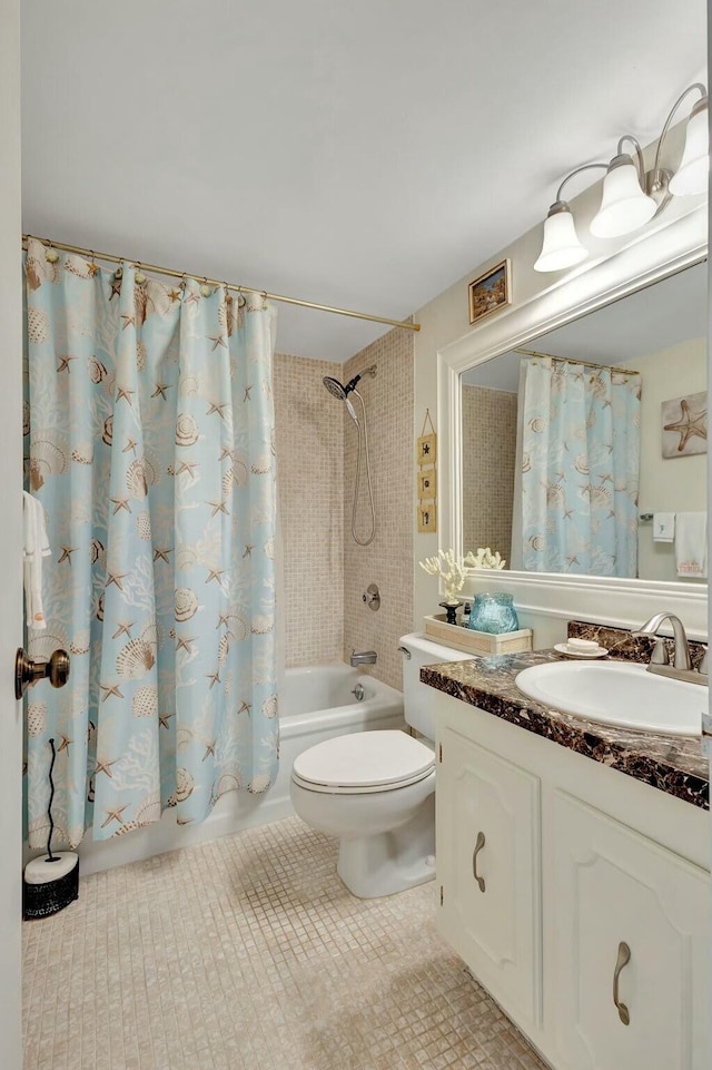 full bathroom with tile patterned flooring, shower / bath combo, toilet, and vanity