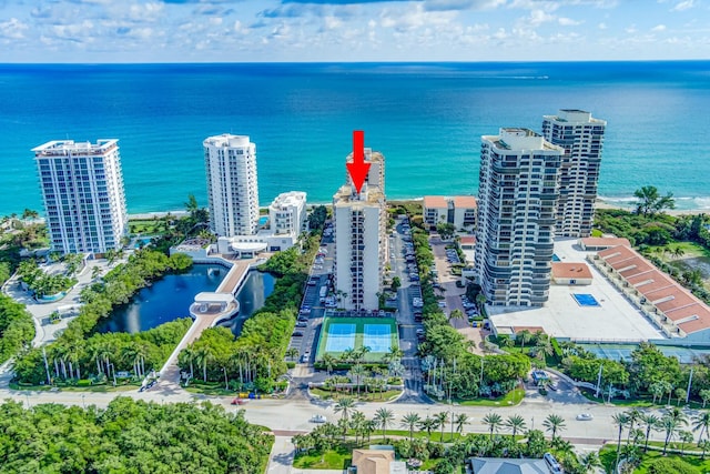 birds eye view of property with a water view