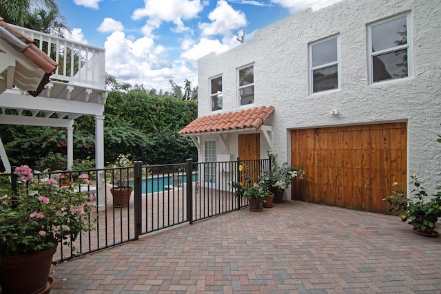 view of patio featuring a fenced in pool