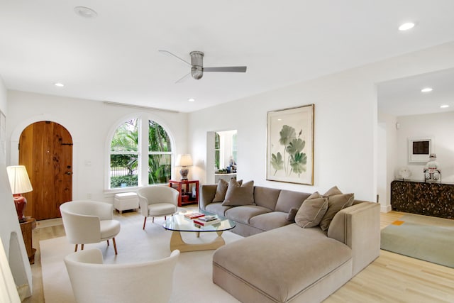 living room featuring ceiling fan and light wood-type flooring