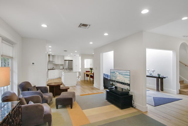 living room with light hardwood / wood-style flooring