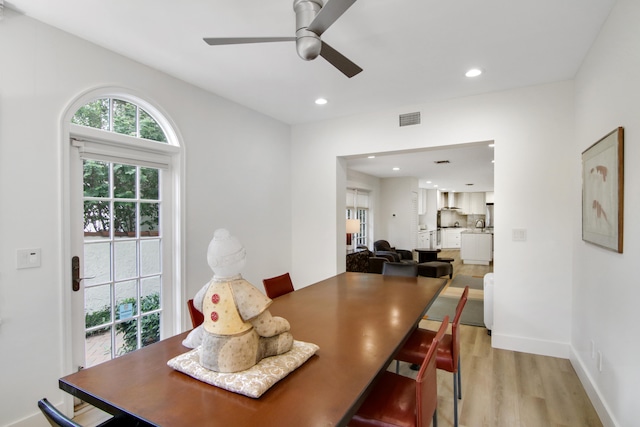 dining space featuring ceiling fan and light hardwood / wood-style flooring