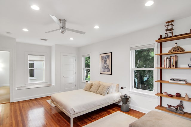 bedroom featuring ceiling fan and hardwood / wood-style floors