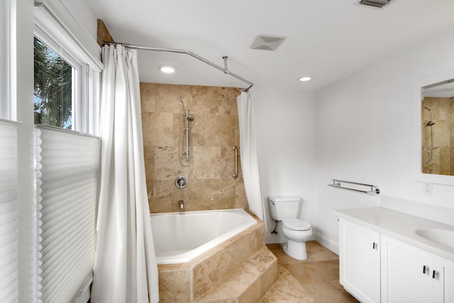 full bathroom featuring vanity, toilet, and shower / tub combo