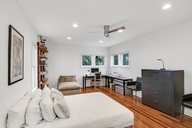 bedroom with ceiling fan and wood-type flooring