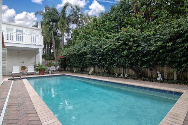 view of swimming pool featuring a patio area